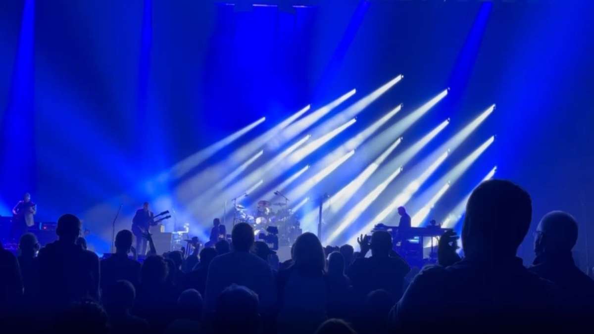 Concert crowd lit in blue